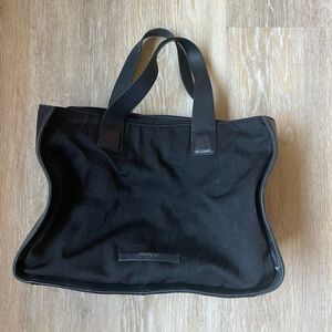 DKNY black synthetic hand bag with zipper